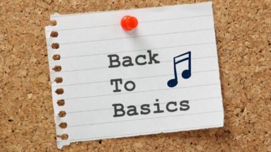 Words "Back to Basics" pinned on a board