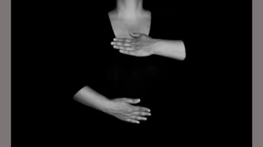 Woman with her hands on chest and stomach