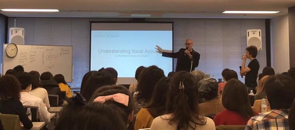 John henny lecturing in Japan