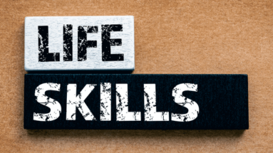 wood blocks with the words "life" and "skills" printed on them