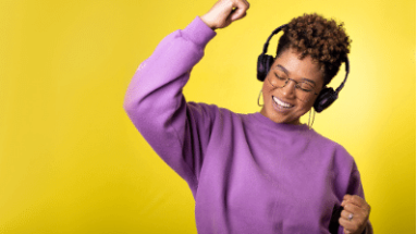 photo of a woman listening to music and dancing