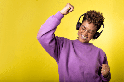 photo of a woman listening to music and dancing