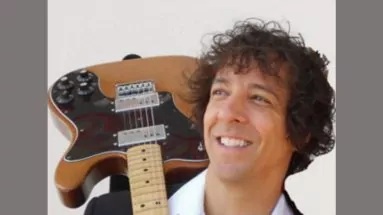 Daniel Formica with a guitar