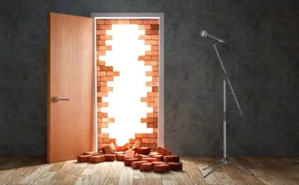 Door with brick wall broken behind it