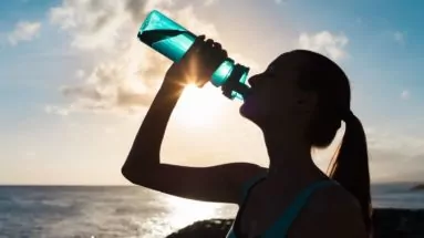 Woman drinking from a water bottle