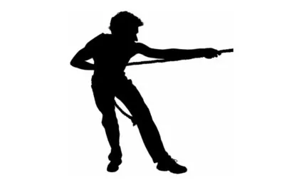 image of man struggling and pulling a rope