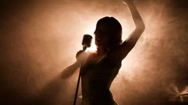 Woman singing on stage