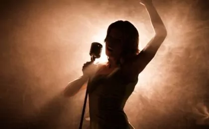 Woman singing on stage