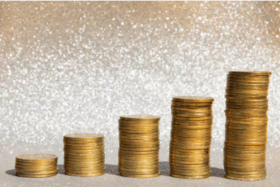 ascending coin stacks photo of stacks of coins that get increasingly taller