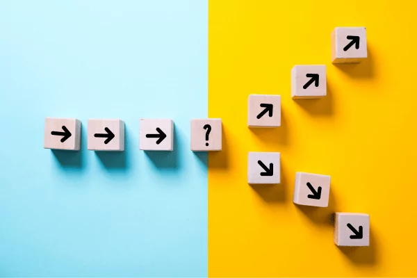 decisions photo of a line of arrows that split into two directions