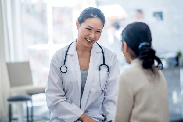 photo of a doctor and her patient