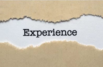 photo of torn strip of paper revealing the word "experience"