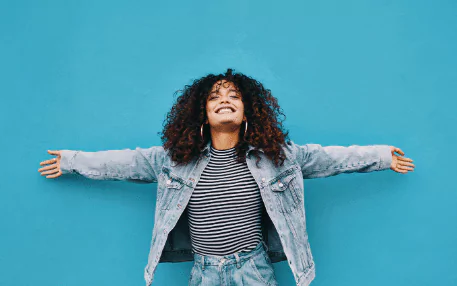 freedom photo of a smiling woman with her arms out
