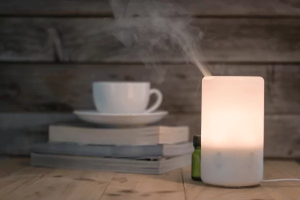 photo of a humidifier and a cup of tea