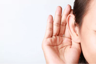 photo of a hand cupped to an ear