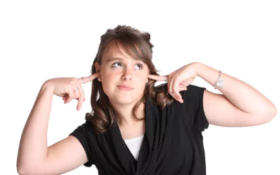 not listening photo of a girl plugging her ears