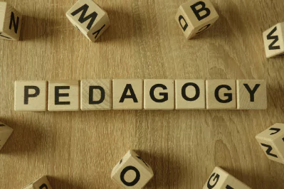 photo of letter blocks spelling out the word pedagogy
