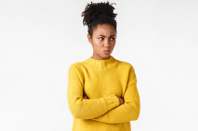 quit photo of a woman pouting with her arms crossed