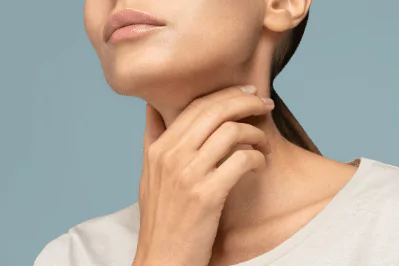 photo of woman touching her throat